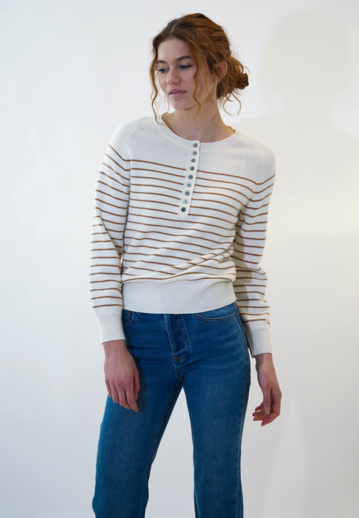Model wearing alexa sweater brown stripes against white background