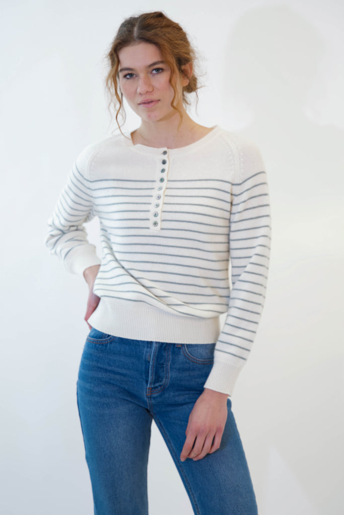 Model posing while wearing alexa sweater