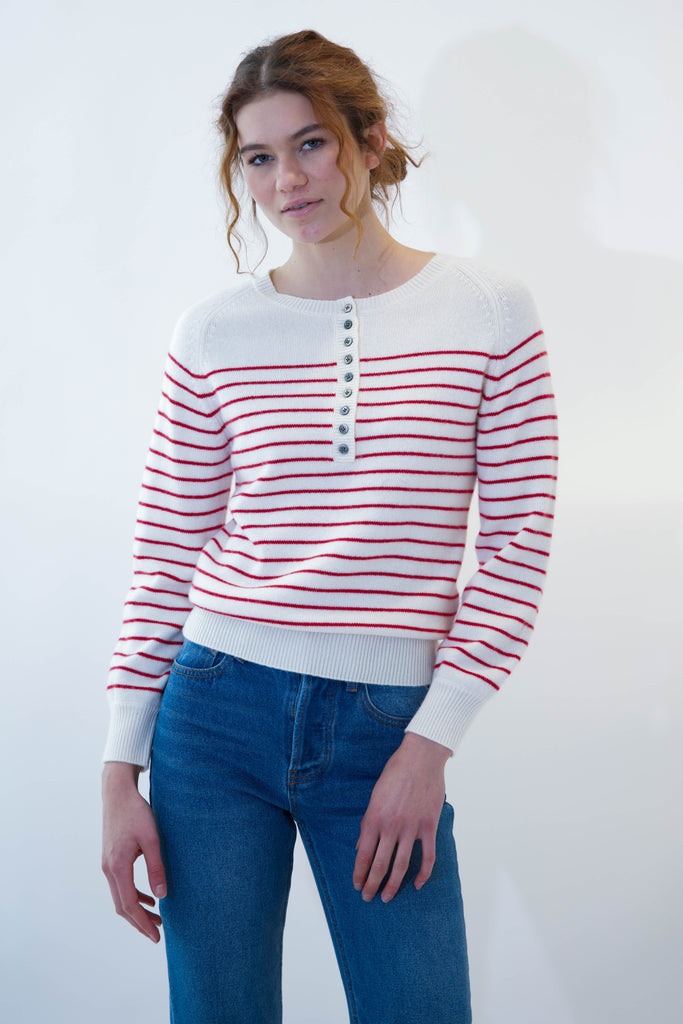 Model wearing alexa sweater red stripes on white background
