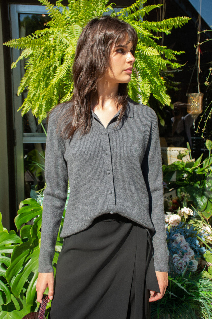 Woman wearing grey knit cardigan