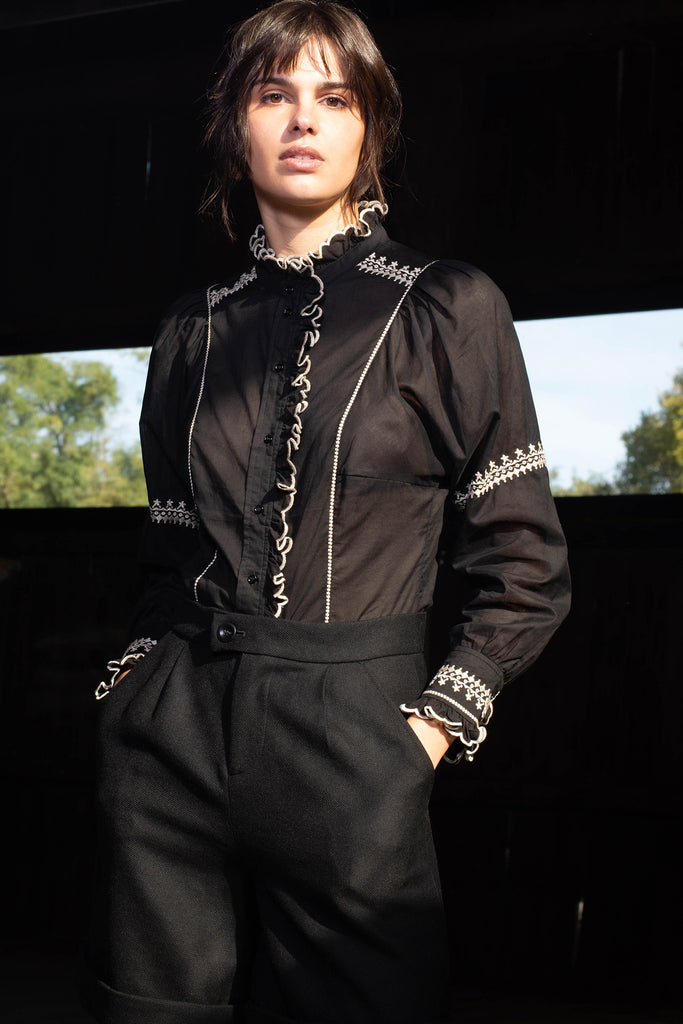Woman wearing black Auriane princess seam blouse