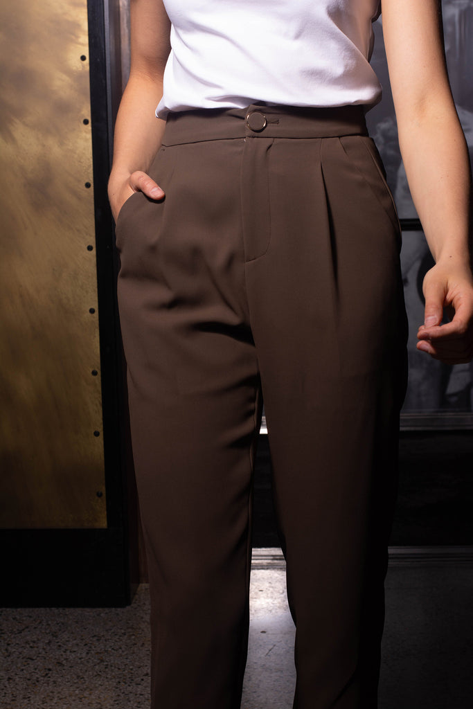 Woman wearing Leile brown flare pants