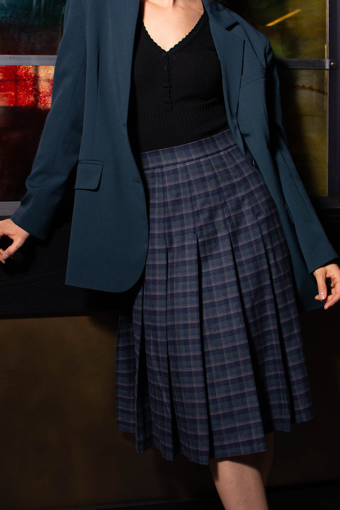 Woman wearing Roxi blue plaid skirt